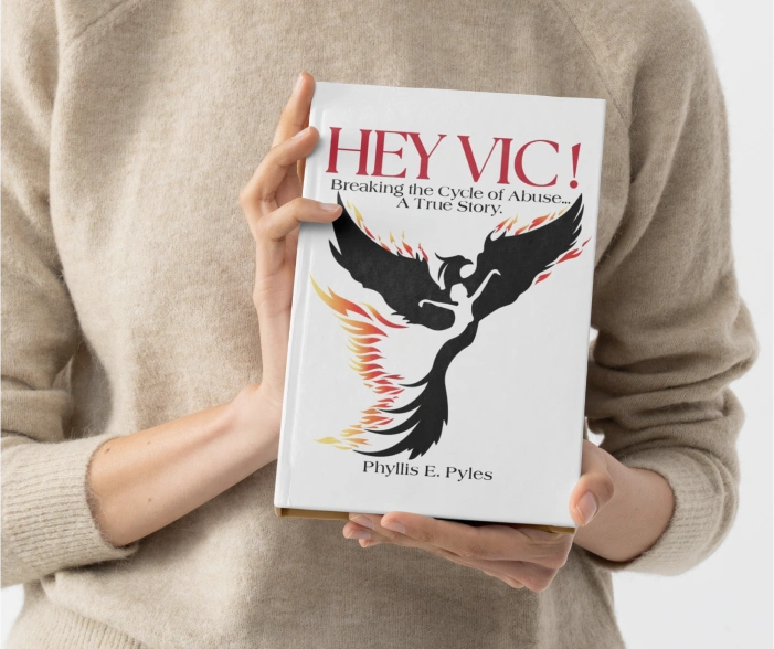 woman holding Hey Vic! book